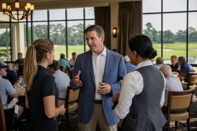 Manager In Dining Room Overlooking Golf Course