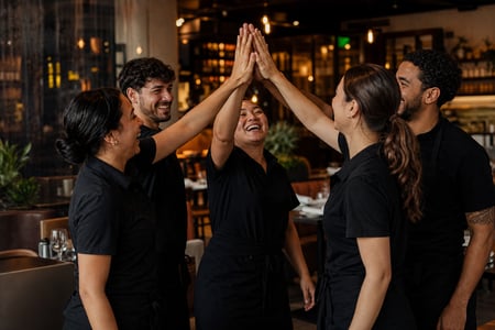 Restaurant Staff Celebrating in Black Attire