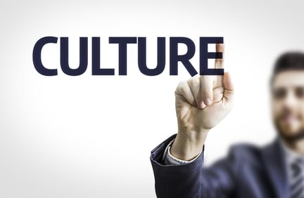 Business man pointing the text Culture-1