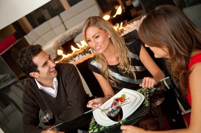 Group of friends having dinner at a restaurant