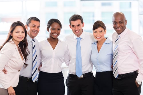 Happy group of business people together at the office