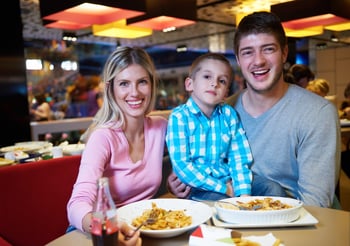 family together have break at lunch in shopping mall